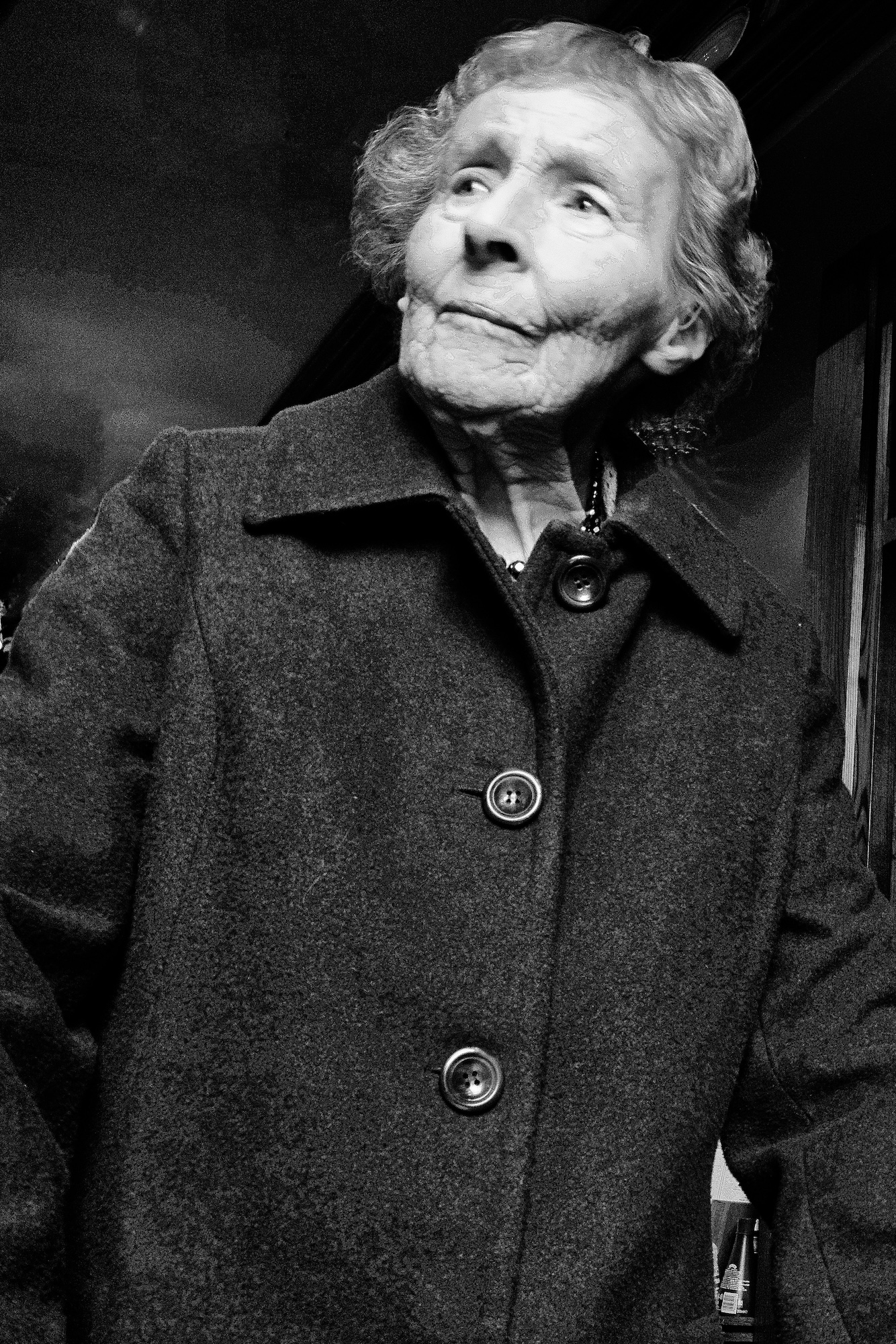 black and wwhite upper torso image of a determined older woman