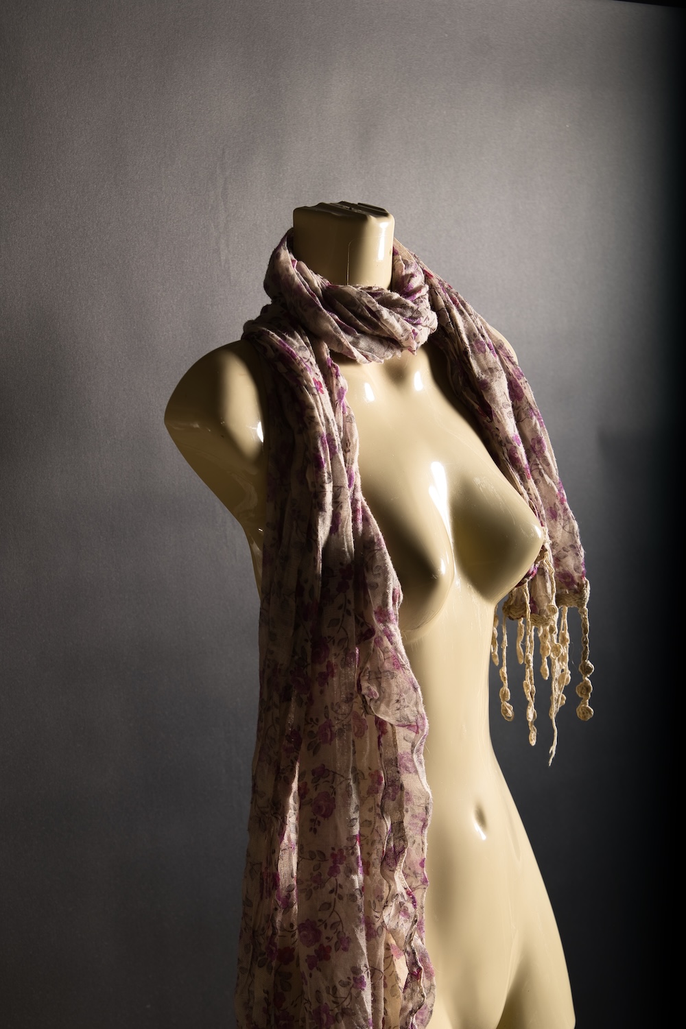 colour torso image of a dressing dummy with scarf
