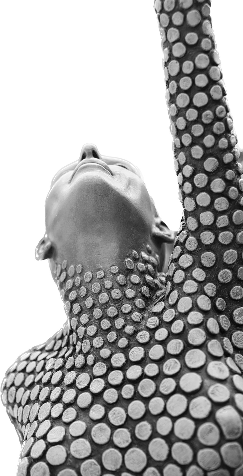 low angle photograph of a sculpture stretchin in a yoga position