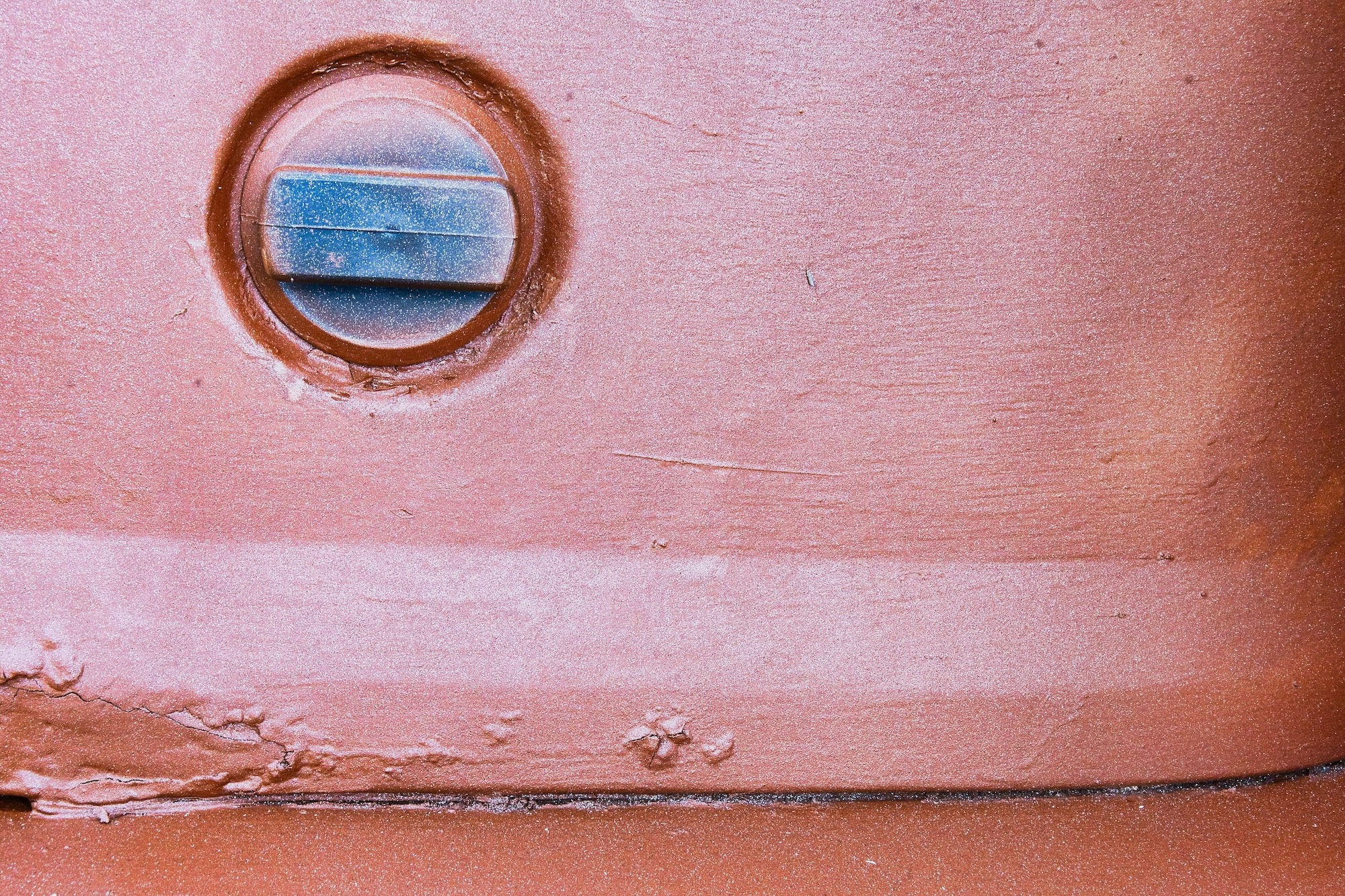 detail of a filler can on a repainted but rusty Bedford truck