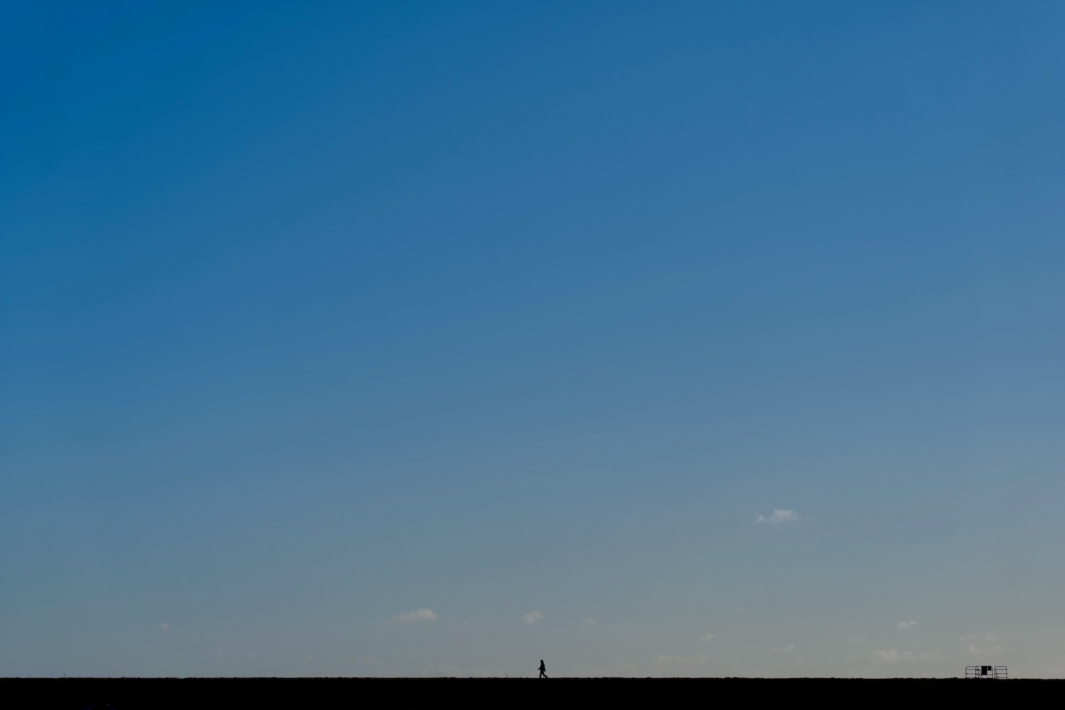 Small prson in big sky at Pett Level, East Sussex