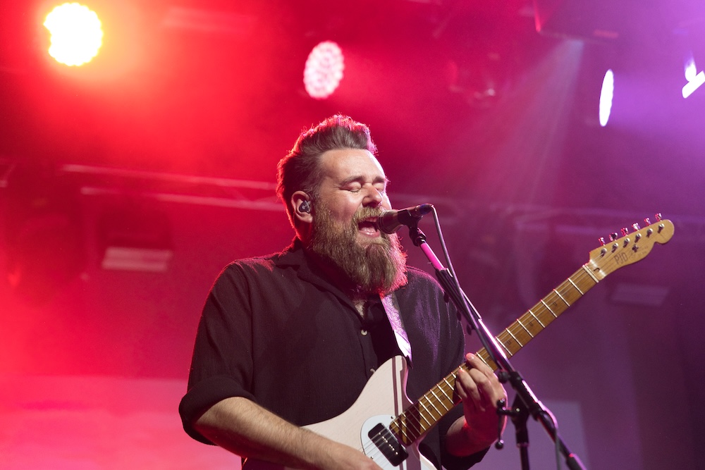 Lottery Winners guitarist playing on stage