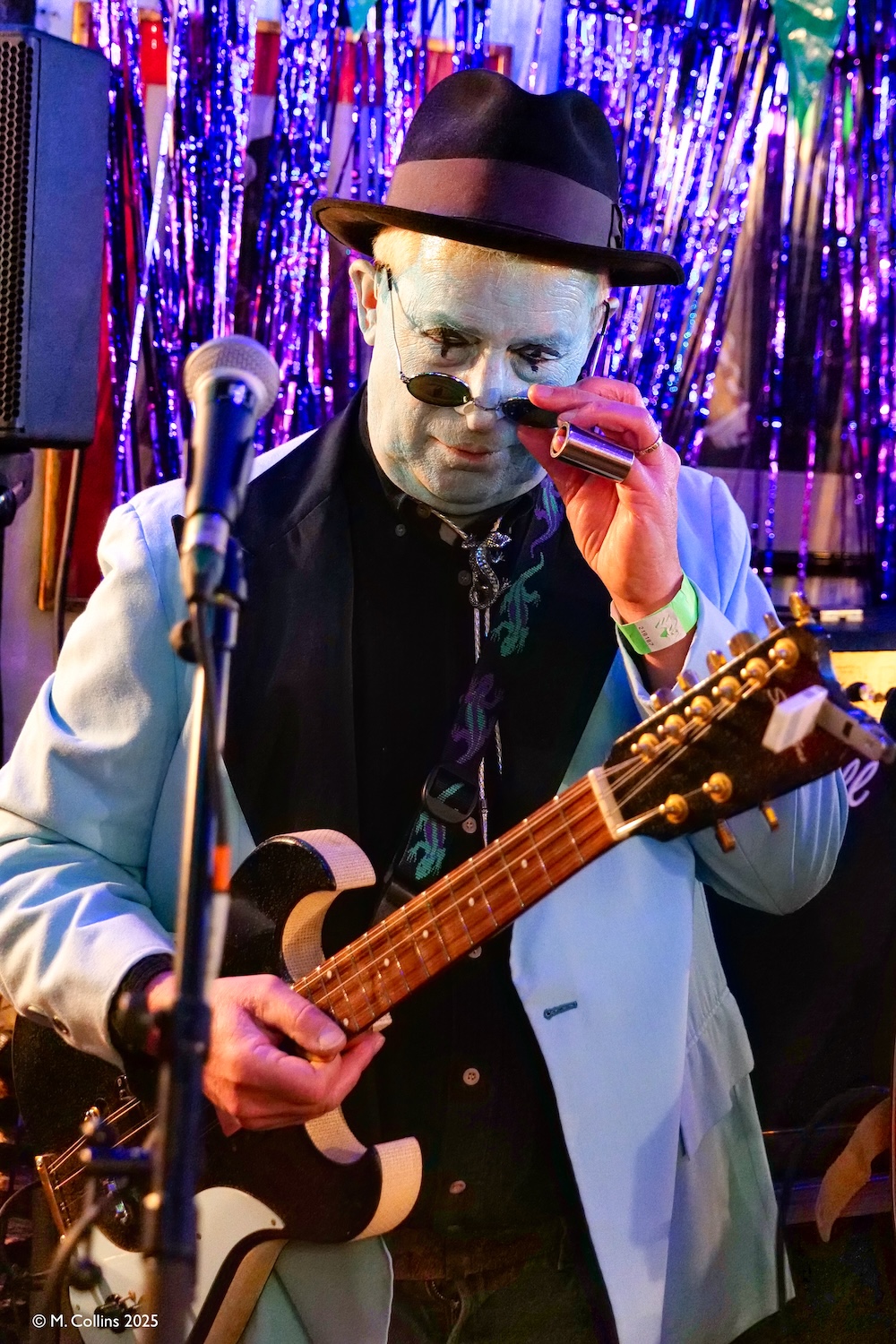 Pepe belmondo band bass player with white make-up and black eyes
