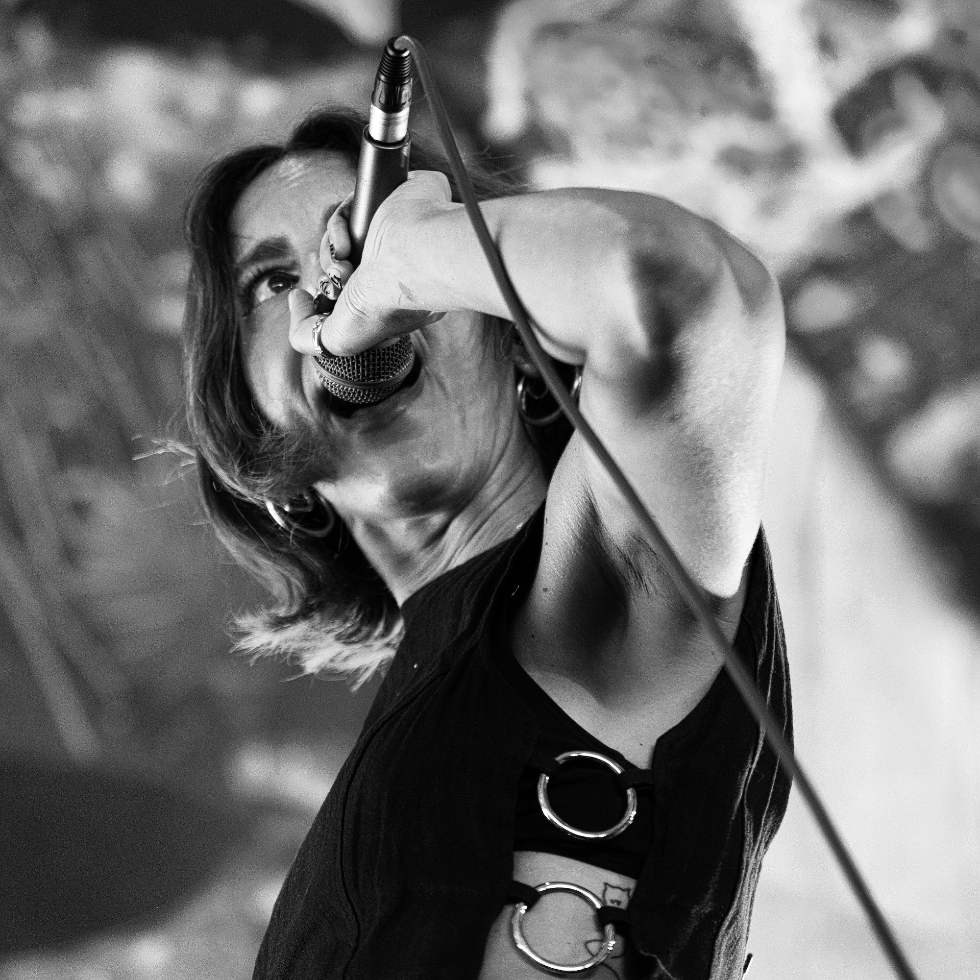 black and white image of a singer with eye contact